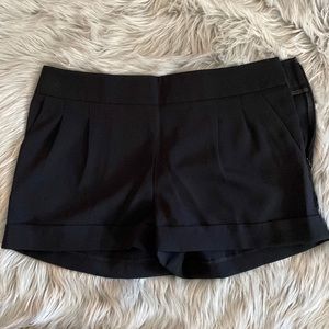 NWT Express black polyester shorts. 2 1/4” inseam with cuff. Very dressy. Size 4